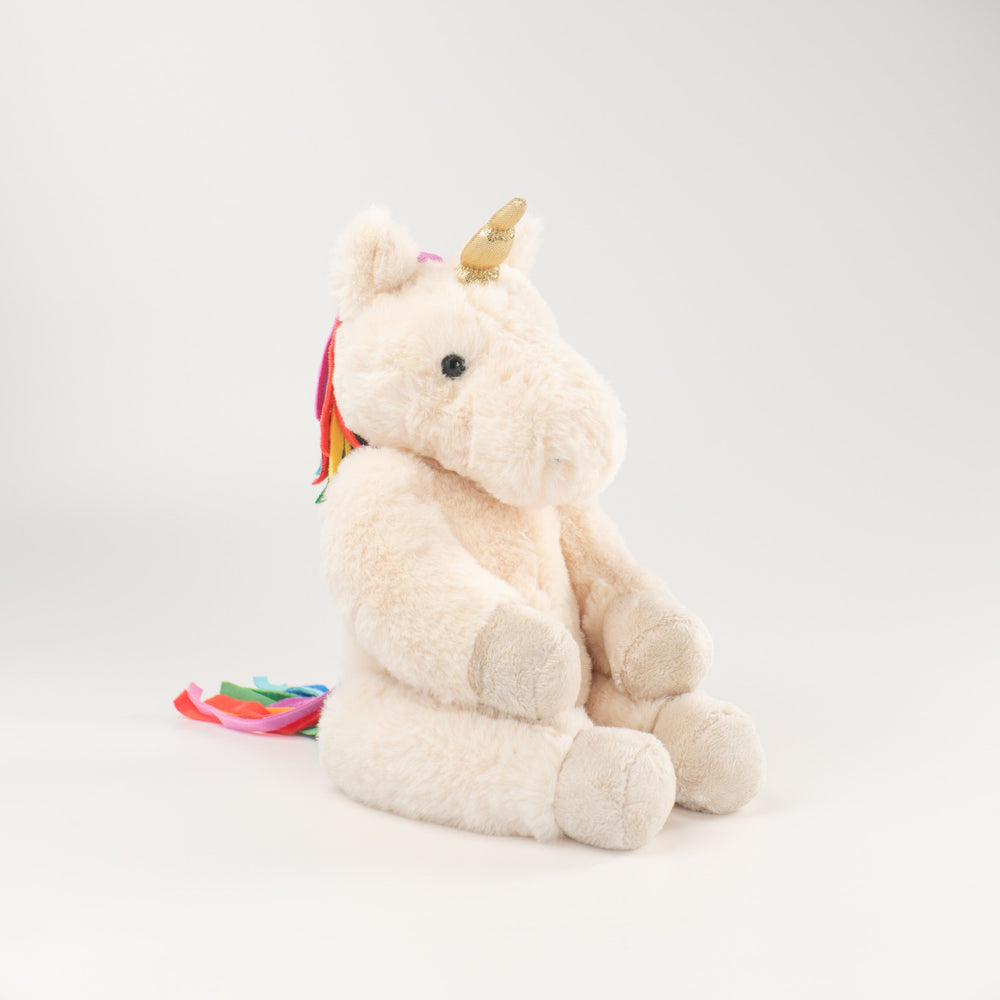 Wonderlings Gilbert Unicorn plush toy, side view.