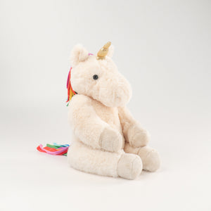 Wonderlings Gilbert Unicorn plush toy, side view.
