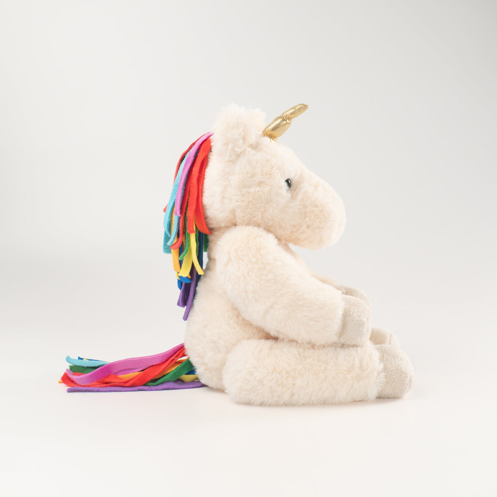 Wonderlings Gilbert Unicorn plush toy, side view.