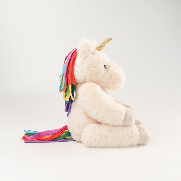 Wonderlings Gilbert Unicorn plush toy, side view.